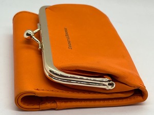 lot 65 image: Dooney and Bourke Orange Pebble Grain Leather Coin Wallet