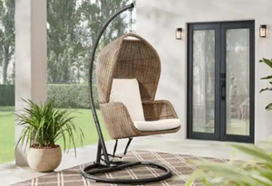 lot 22 image: HAMPTON BAY Melrose Park Brown Closed Wicker Outdoor Patio Egg Swing Close with CushionGuard Almond Biscotti Cushions (IN BOX)