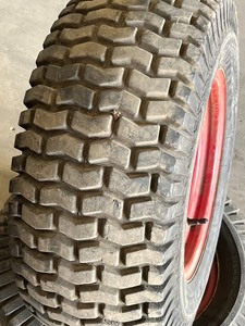 lot 35 image: (2) 23x9.50x12 Turf Tires On A 5-Lug Steel Wheel