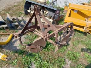 lot 28 image: Early Model Dearborn 2-Bottom Plow - 14-inch, Round Tag on Plow reads Dearborn Motors