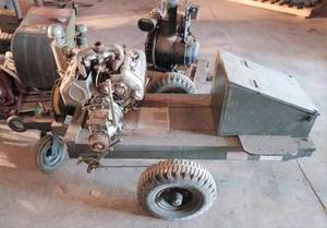 lot 43 image: Wisconsin VE4  4-cylinder Engine with Gearbox and Generator on a 2-Wheel U.S. Army Trailer