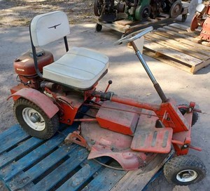 lot 66 image: Vintage Toro 6 hp. Rear Engine Riding Mower in Good Original Condition