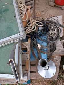 lot 170 image: Pallet of Boating Items Tempered Glass Spit Windshield with Aluminum Frame, 3-Wood Swimming Platforms, and More