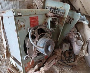 lot 207 image: Gas Furnace, Modine Hanging Gas Furnace, and a Central Air Compressor (Condition Unknown)