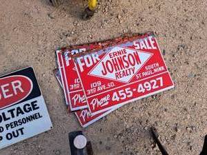 lot 439 image: Lot of (5) Ernie Johnson Realty Metal Signs