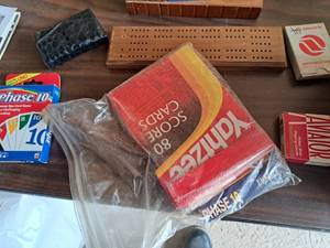 lot 577 image: Lot of (7) Games - Cribbage Board, Yahtzee Score Cards, Phase 10 Card Game, Aviator Playing Cards