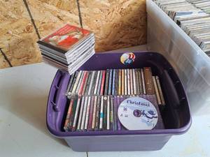 lot 596 image: Lot of (1 Purple Plastic Tub) Music CDs - Holiday Classics, Huey Lewis & News, Costa Rica Sampler, Los Lobos, Lynyrd Skynyrd, and many more