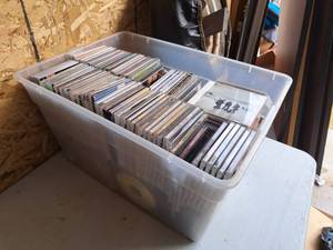 lot 594 image: Lot of (1 Plastic Tote Bin) Music CDs - Heavenward, Boyz II Men, Mel Tillis, Kenny Rogers, Reba, Nickleback, Chad Johnson and many more