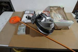 lot 95 image: Assorted Items - Portable Steamer, Porcelain Doll, Earbuds, Curtains