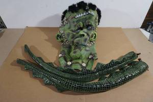 lot 104 image: Frankenstein Halloween Mask plus Dragon Tails