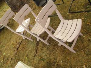 3 Plastic folding chairs...
