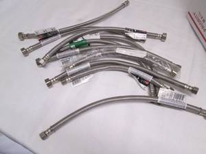 lot of assorted metal faucet hose l...