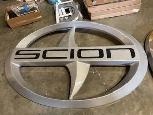 lot 6 image: Scion Motors vacuum formed plastic back lit logo dealership sign