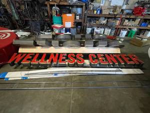 lot 10 image: Wellness Center light up channel letters mounted on raceway
