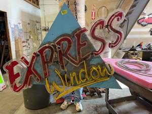 lot 27 image: Express Window neon sign on aluminum can