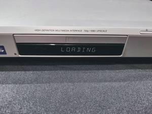 lot 4 image: DVD Player and Assortment of 60 DVDs (Tested Working)