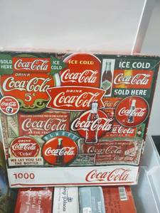 lot 12 image: Huge Assortment of Puzzles (Coca Cola Classic)