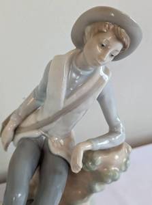 lot 41 image: Lladro Porcelain Country Boy Figurine