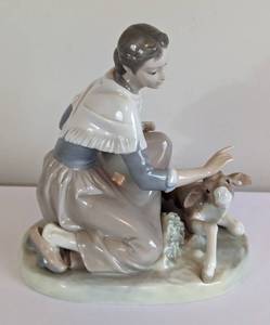 lot 47 image: Lladro Caressing the Calf Porcelain Figurine