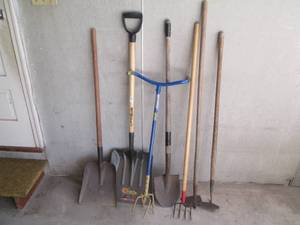 Lot of yard tools including shovels...