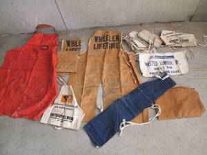Lot of nail and shop aprons...