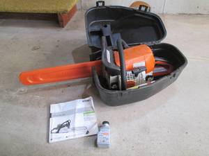 Stihl chainsaw with manual and acce...