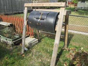 55 gallon Composting barrel on a wo...