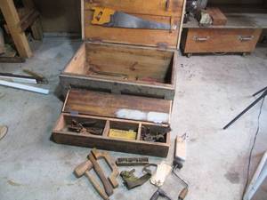 Wood chest filled with vintage hand...