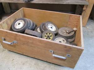 Wood box on wheels filled with lawn...