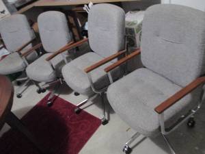 4 upholstered swivel chairs on cast...
