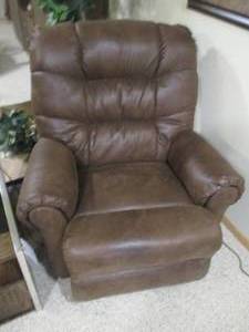 Rocking recliner in plush faux leat...