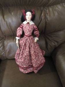 Porcelain doll on stand, figure fro...
