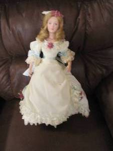 Porcelain doll on stand, figure fro...