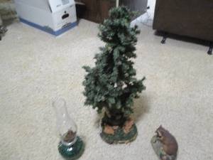 Oil lamp, racoons and pine tree dec...