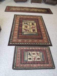 3 different size cozy up North rugs...