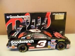 ACTION COLLECTABLES - 124  SCALE DIE CAST - DALE EARNHARDT #3 GOODWRENCH PARTS PLUS - 1997 MONTE CARLO
