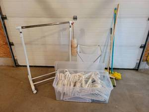 lot 267 image: Rolling Clothes Hanger Rack, Sweeper, Dusters and HUGE Tote of Hangers - NO SHIPPING