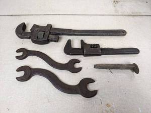 lot 143 image: Lot of Tools - Pipe Wrenches, Antique Wrenches, and a Railroad Spike