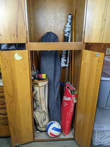 lot 146 image: Lot of Sporting Goods in Closet - Includes Badminton Net, Racquets, Golf Clubs, Hockey Stick, Canoe Paddles, and MORE NO SHIPPING