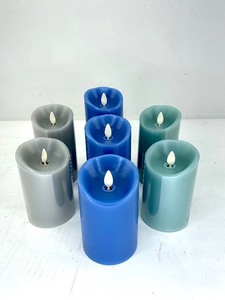 lot 425 image: 7 Luminara Flameless Pillar Candles in Blue, Green, and Gray
