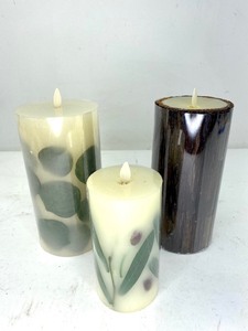 lot 436 image: 3 Luminara Flameless Pillar Candles, Pressed Leaves and Bark