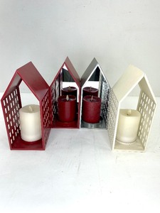 lot 433 image: 4 Luminara White and Red Flameless Pillar Candles with House Shaped Holders