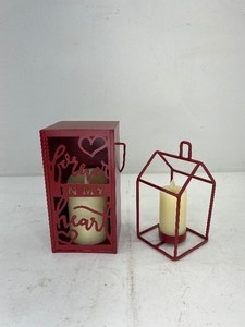 lot 475 image: 2 Luminara Flameless Ivory Pillar Candles with Red Metal Holders
