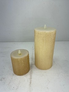 lot 489 image: 2 Ivory Flameless Pillar Candles with Textured Details, Luminara