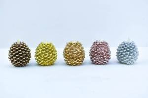 lot 197 image: 5 Luminara Metallic Finish Pinecone Wax Flameless Candles