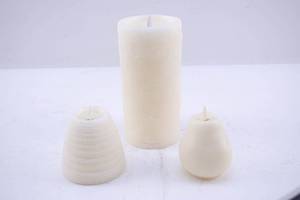 lot 497 image: 3 Textured Ivory Flameless Candles, Luminara