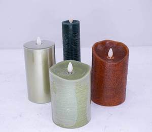 lot 457 image: 4 Luminara Green, Teal, and Orange Flameless Candles