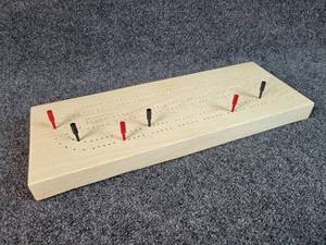 lot 3024 image: Solid Maple Cribbage Board with Wooden Pegs