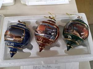 lot 720 image: Lot of (3) Sharing the Season I, Sharing the Season II and Lights of Home by Terry Redlin Collectors Ornaments