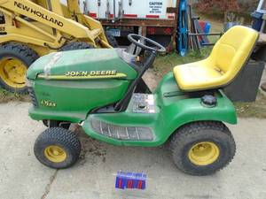 John Deere LT155 Hydro tractor. 15 hp. No deck included. Starts & runs but dies after a few minutes. As shown.